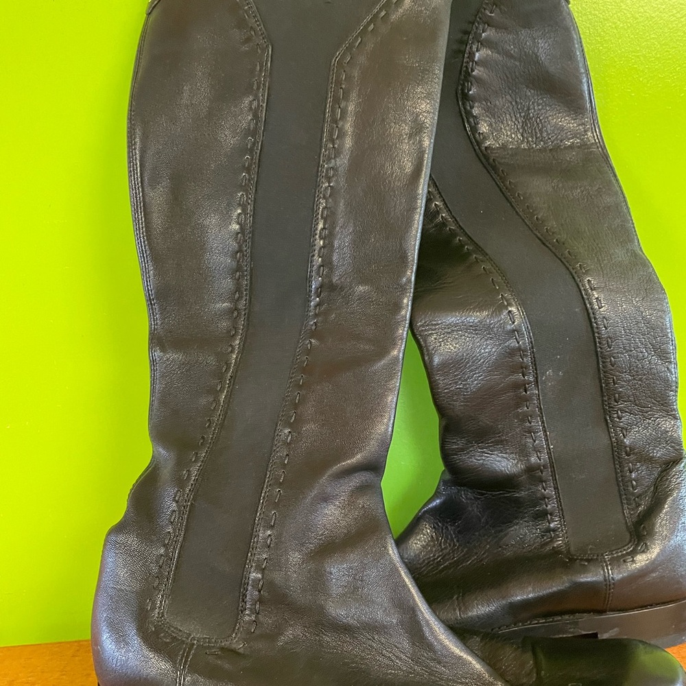 Saint Laurent, black leather knee- high boots.